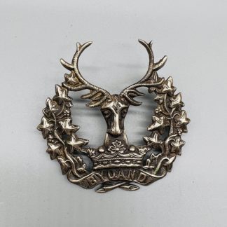 The Gordon Highlanders Cap Badge, constructed in white metal