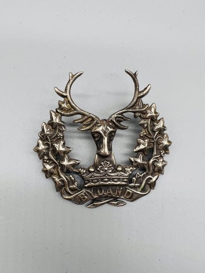 The Gordon Highlanders Cap Badge, constructed in white metal