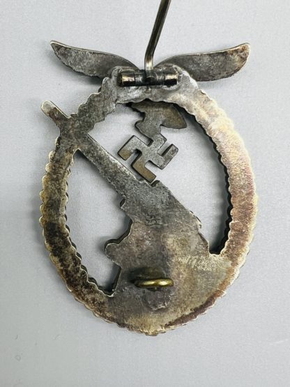 Luftwaffe Flak Badge, reverse image with barrel hinge, flat wire catch, and Assmann makers mark