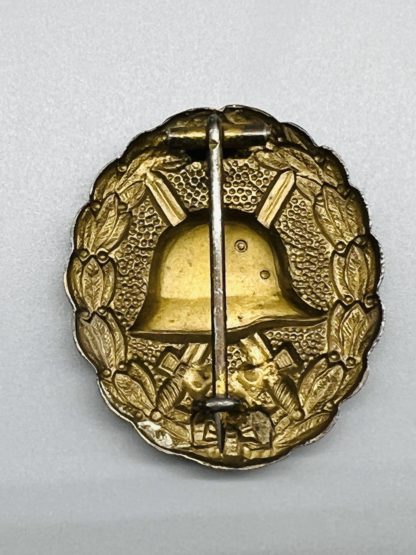 WW1 German Wound Badge In Gold, reverse image with barrel hinge.