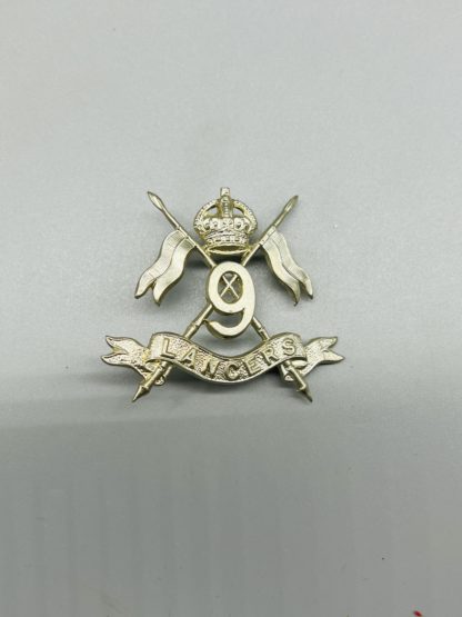 British 9th Queen's Royal Lancers Cap Badge, constructed in white metal.