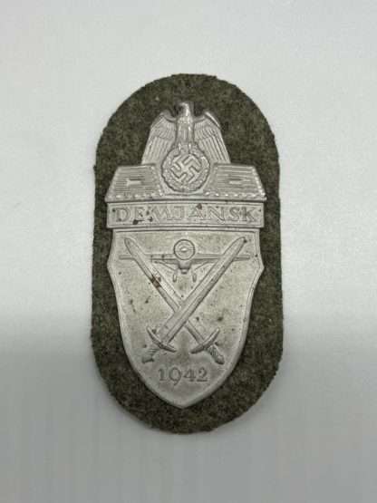 WW2 Heer Demjansk Shield By Deschler & Sohn, with backing cloth.