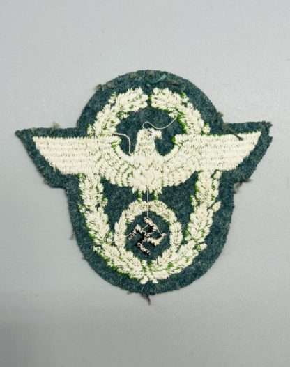 WW2 German Schutzpolizei Sleeve Eagle Badge, reverse image