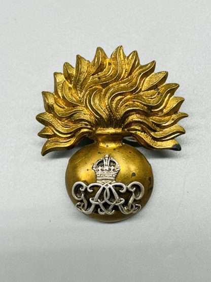 Grenadier Guards GVI Warrant Officers Cap Badge, in brass with Royal Cypher reverse and interlaces in gilt silver.