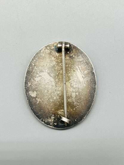 WW2 German Wound Badge Silver Unmarked Tombak, rear image with vertical pin.