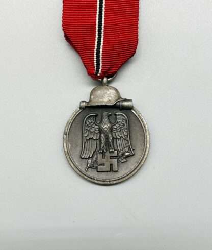 A WW2 German Eastern Front Medal Marked "110" By Otto Zappe, with original ribbon.
