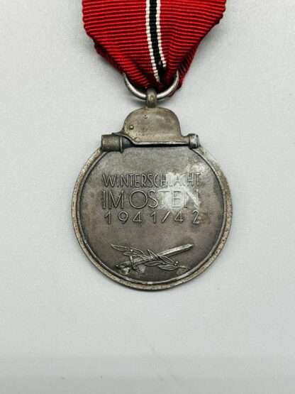 A WW2 German Eastern Front Medal reverse image, with original ribbon.