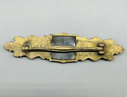 Close Combat Clasp In Bronze By Gablonz, reverse image of the tapered pin, and clasp.