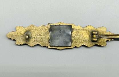 Close Combat Clasp In Bronze By Gablonz, reverse image on the clasp.