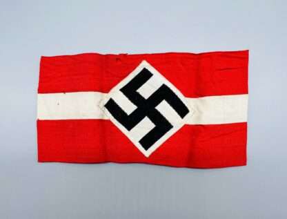 A genuine WW2 German Hitler Youth cloth Armband, with a small hole above the swastika.