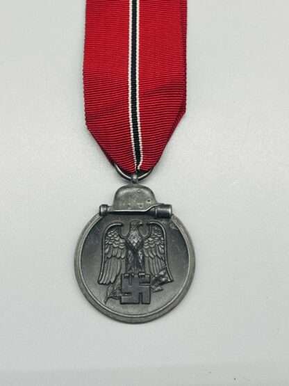 A WW2 German Eastern Front Medal Marked 93 on the medal ring, with a nice long ribbon.