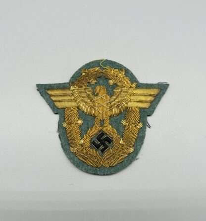 German Schutzpolizei Officers Sleeve Eagle Badge, in gold bullion.