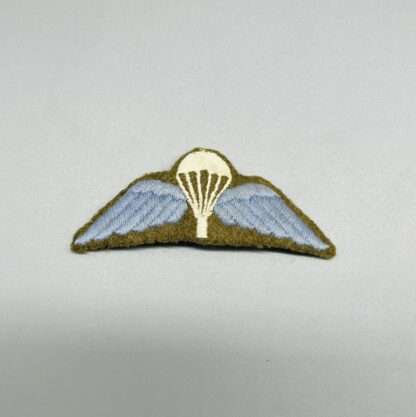 A WW2 British Paratrooper Jump Wings embroidered in cloth on Khaki backing.