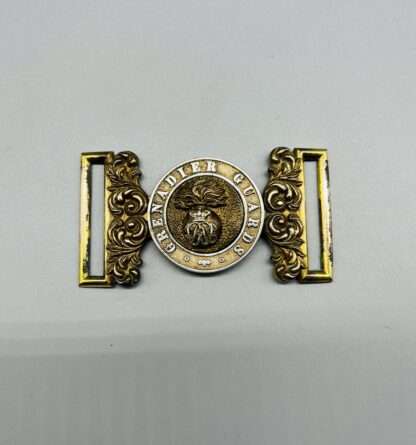 A Grenadier Guards Officers Victorian belt buckle in brass, with the regimental emblem in the centre.