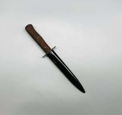 A WW2 German Luftwaffe Combat Boot Knife with scabbard.