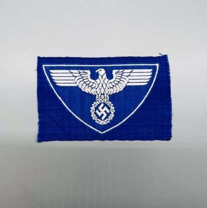 A Reichspost Sports Vest Insignia, with eagle facing the left in white on blue backing.