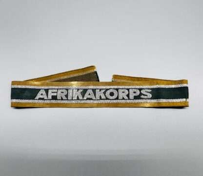A WW2 German AfrikaKorp Cuff Title, machine embroidered.