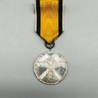 A Scarce WW2 German Mine Rescue Honour Medal with National Eagle, with cross hammers and yellow, black, and white ribbon.