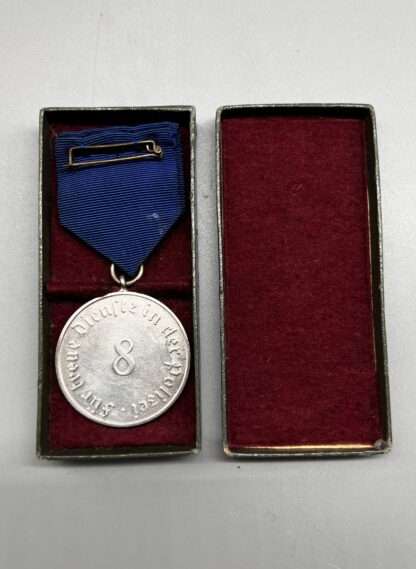 A WW2 German Police Long Service Medal 8 Years, constructed in silvered tombac with period blue ribbon with 8 embossed in the centre, complete with presentation box lined in red felt.