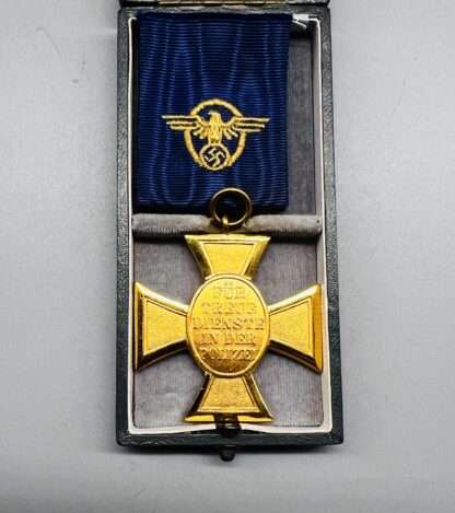A reverse image of WW2 German Police Long Service Medal 25 Years, with period ribbon with embroidered insignia. The medal is incribed "Fur Treue Dientste In Der Polizei (For Loyality Served In The Police).
