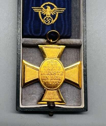 Reverse image of WW2 German Police Long Service Medal 25 Years, with period ribbon with embroidered insignia. The medal is incribed "Fur Treue Dientste In Der Polizei (For Loyality Served In The Police).