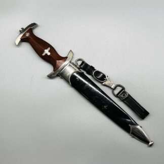 A WW2 German NSKK Dagger By Carl Eickhorn RZM M7/66 1939, with black scabbard and leather hangers and clip.
