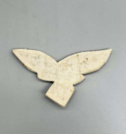 A reverse photo of a Luftwaffe General's Summer Breast Eagle with cotton style backing.
