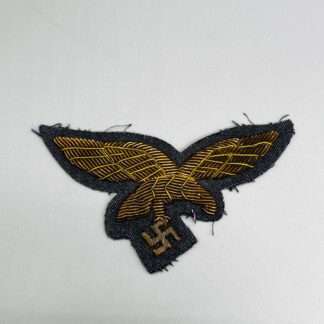 A Luftwaffe General's Summer Breast Eagle,  hand-embroidered in gold bullion on blue backing.