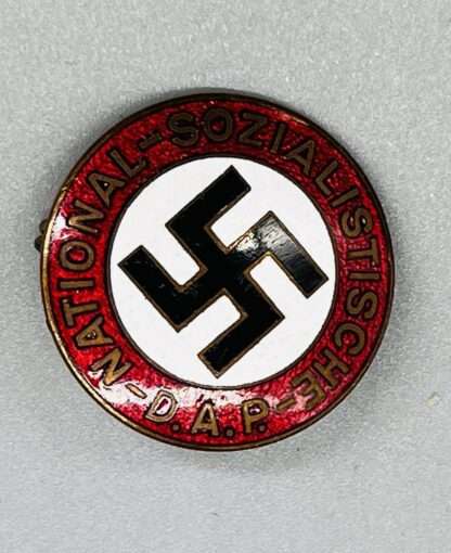 A NSDAP party badge, constructed in red, white, black, and gold enamel
