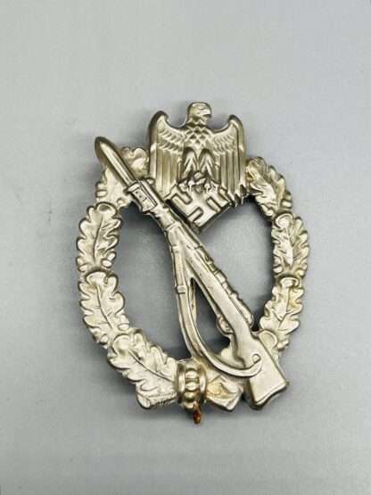 A WW2 German Infantry Assault Badge in Silver by C.E. Juncker, constructed in nickel silver.