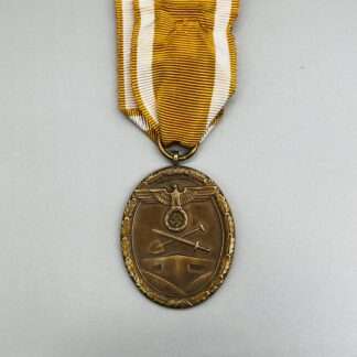 A WW2 Geman West Wall Medal with ribbon.