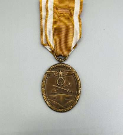 A WW2 Geman West Wall Medal with ribbon.
