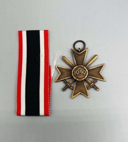 A reverse image of WW2 German War Merit Cross with swords 2nd class, with original medal.