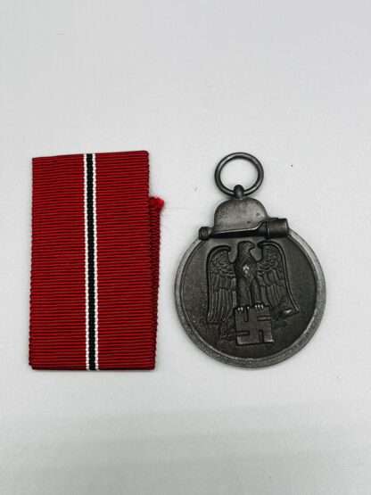 A WW2 German Eastern Front Ostmedaille with ribbon.