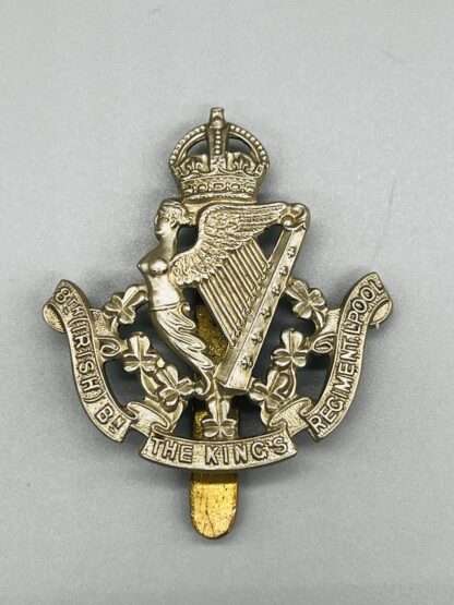A WW2 British 8th (Irish) Battalion the King's Liverpool Regiment Cap Badge, constructed from white metal.