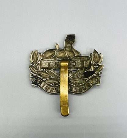A reverse photo WW1 British Gloucestershire Regiment Cap Badge, constructed in white metal with brass slider.