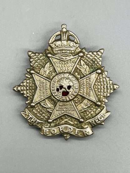 A WW2 Border Regiment Cap Badge, constructed in white metal.