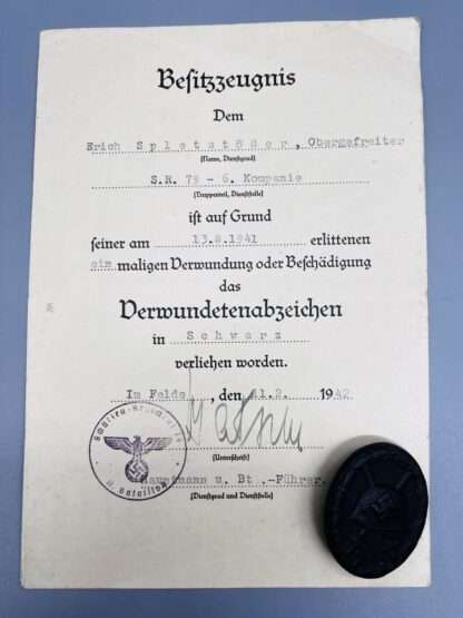 A WW2 German Wound Badge with citation.