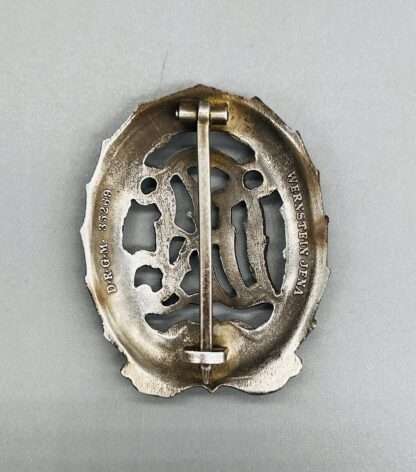 A WW2 German DRL Sports Badge Silver. marked “Wernstein, Jena” and “DRGM 35269."
