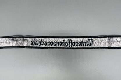 A reverse image of a Heer Unteroffiziervorschule cuff title.