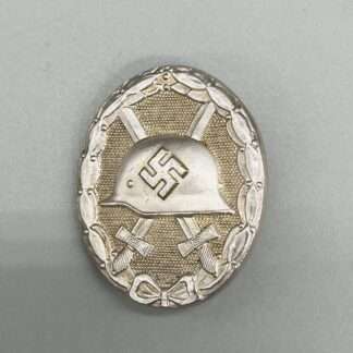 An early desirable WW2 German wound badge in silver, constructed in tombac with nice silver wash and patina.