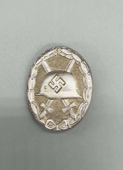 An early desirable WW2 German wound badge in silver, constructed in tombac with nice silver wash and patina.