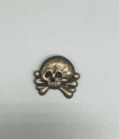 A Panzer Collar Tab Skull, constructed in nickle.