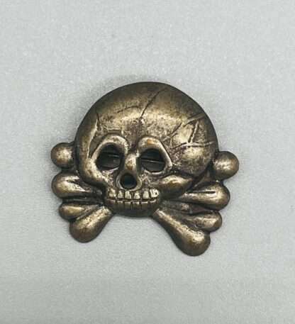 An nice early Panzer Collar Tab Skull, constructed in nickle.