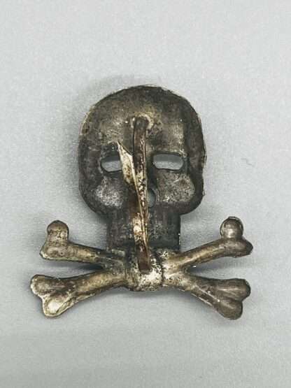A reverse German German Brunswick Skull & Cross Bones 17th & 41st Cavalry, constructed in zinc complete with prongs.
