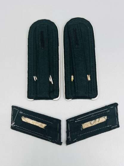 A rear image of a set of Heer Unteroffizier's Shoulder Straps Lehr Infantry 905 Regiment & Collar Tabs.