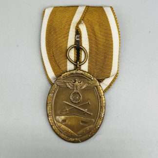 A WW2 German West Wall Medal Court Mounted, with original ribbon.