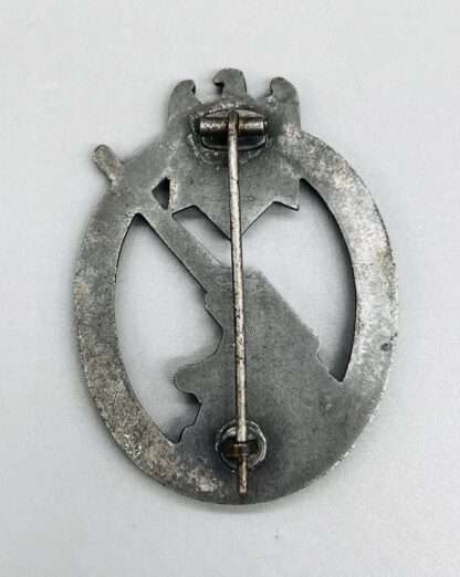 A reverse image of a Heer Flak Badge by Steinhauer & Lück, constructed in zinc with vertical catch.