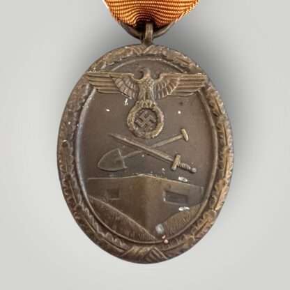 An original WW2 Geman West Wall Medal, we specialise.