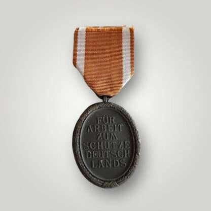 Reverse image of an original WW2 Geman West Wall Medal, we specialise.